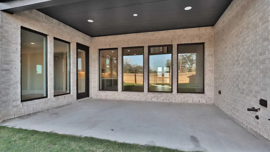 Exterior details and patio area of a home in Elyson 70', Katy (Image 3). Exterior details and patio area of a home in Elyson 70', Katy (Image 3).