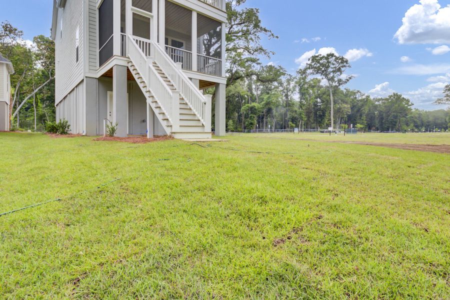 Front exterior of a new home in Indigo Grove Single Family Homes, Johns Island, SC, highlighting curb appeal (Image 29).