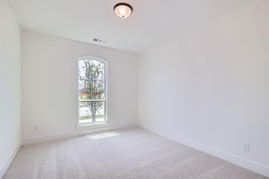 Unfurnished room featuring carpet flooring and baseboards Unfurnished room featuring carpet flooring and baseboards