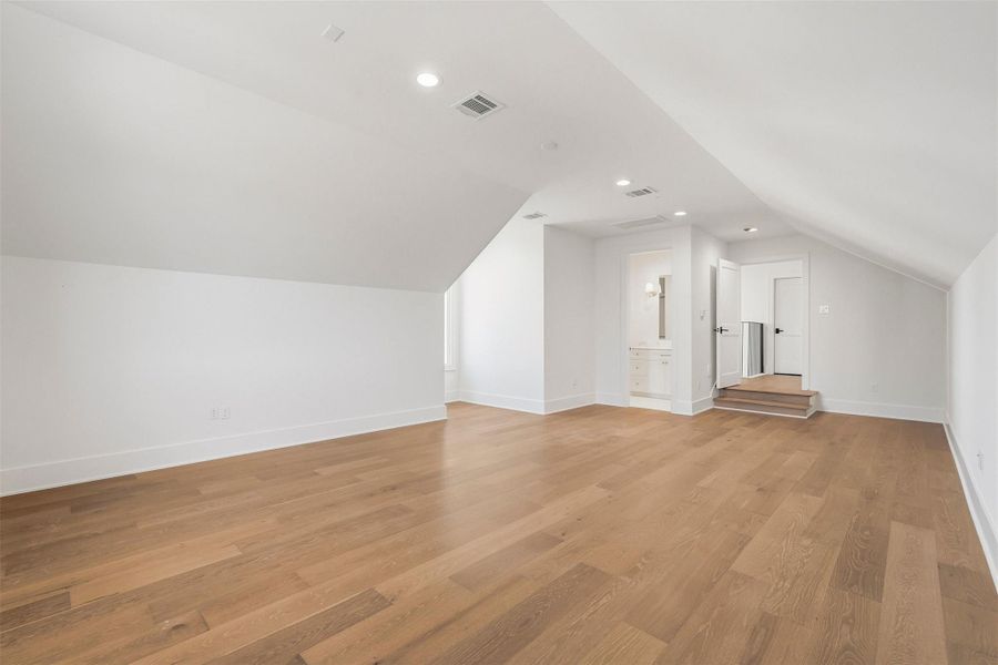 The private set of stairs leads to this spacious, secluded bedroom with ensuite bath located over the expanded double car garage. The private set of stairs leads to this spacious, secluded bedroom with ensuite bath located over the expanded double car garage.