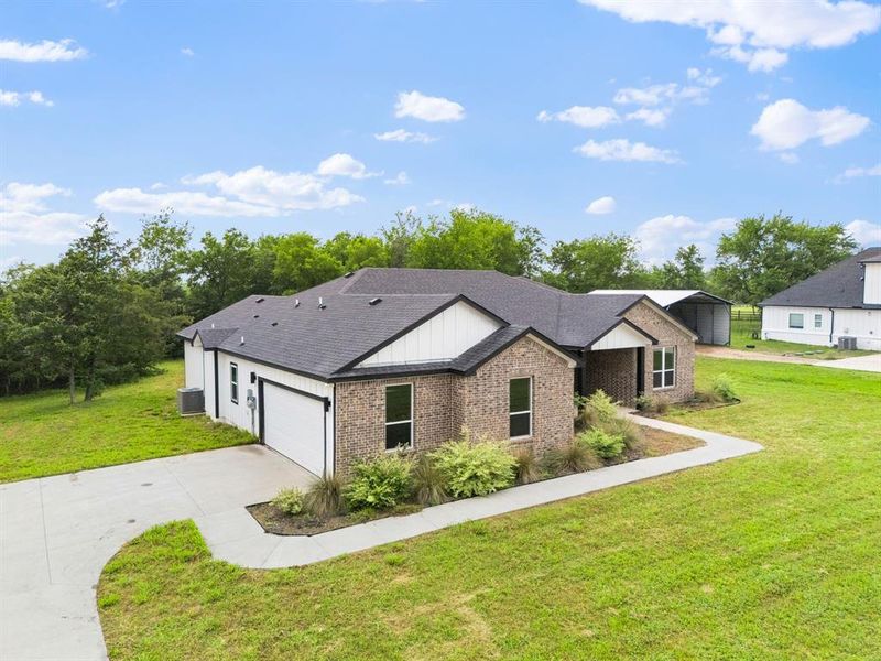 Front exterior of a new home in , Greenville, TX, highlighting curb appeal (Image 20).