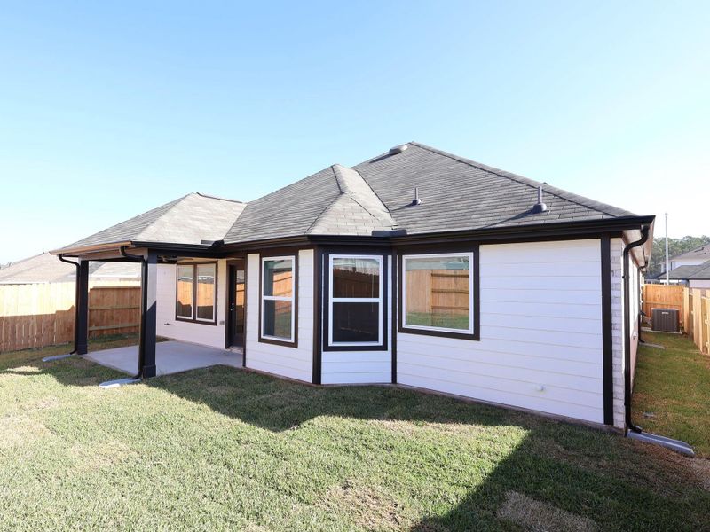 Exterior details and patio area of a home in Magnolia Ridge, Magnolia (Image 23).