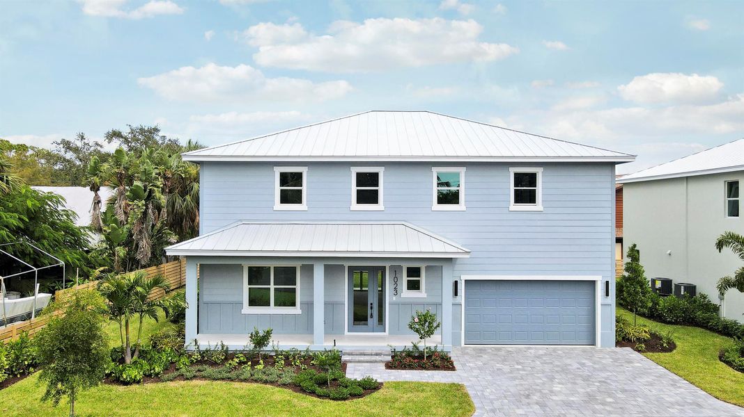 Front exterior of a new home in , Jensen Beach, FL, highlighting curb appeal (Image 27).