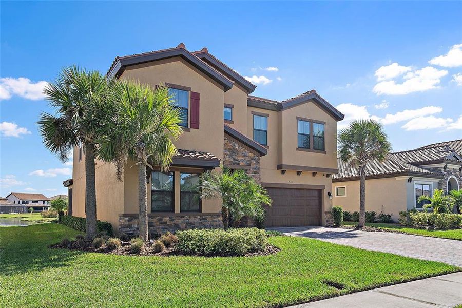 Front exterior of a new home in , Parrish, FL, highlighting curb appeal (Image 2).