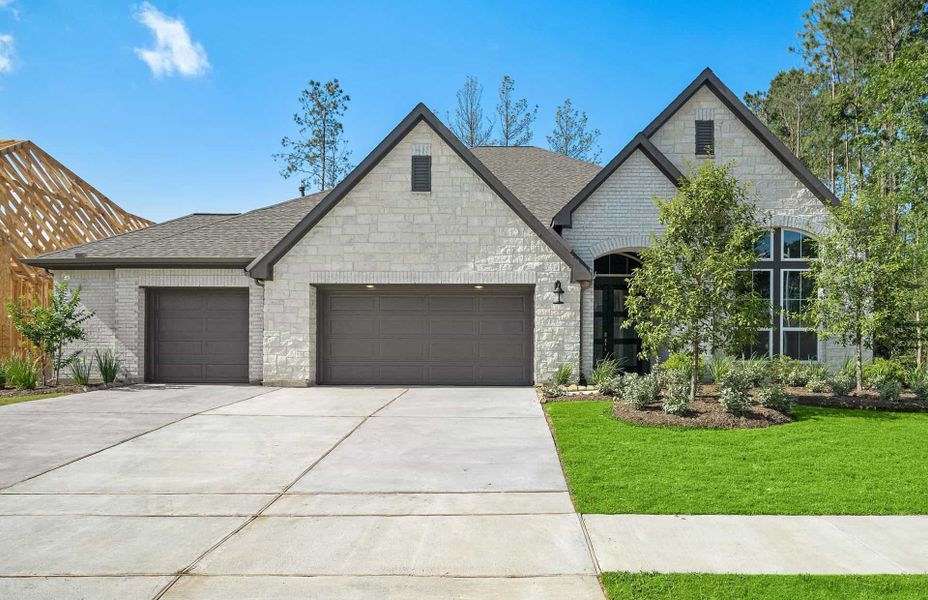 Front exterior of a new home in Artavia 70′, Conroe, TX, highlighting curb appeal (Image 26).