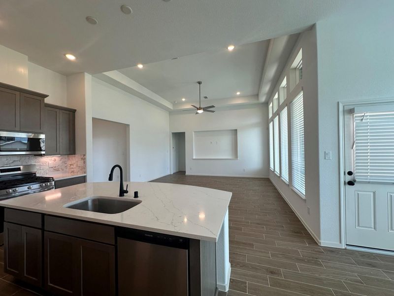 Furnished interior view inside a new home in Creekhaven, Iowa Colony (Image 13).