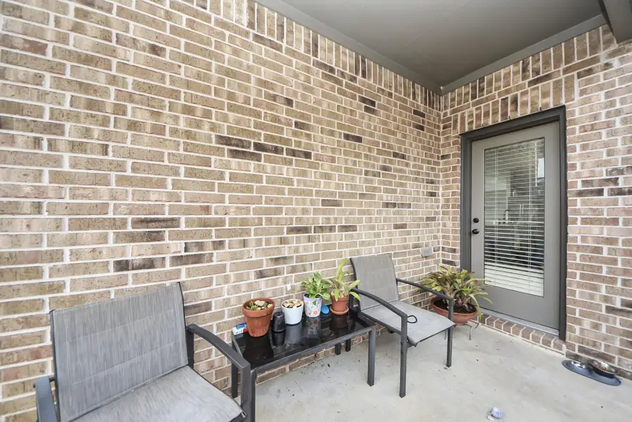 Covered back patio, perfect for relaxing.