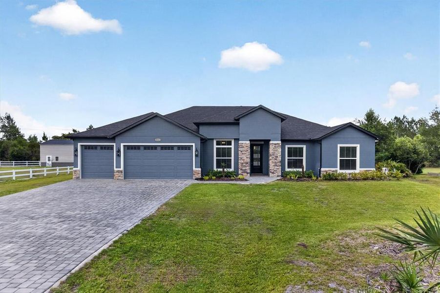 Front exterior of a new home in , Orlando, FL, highlighting curb appeal (Image 2). Front exterior of a new home in , Orlando, FL, highlighting curb appeal (Image 2).