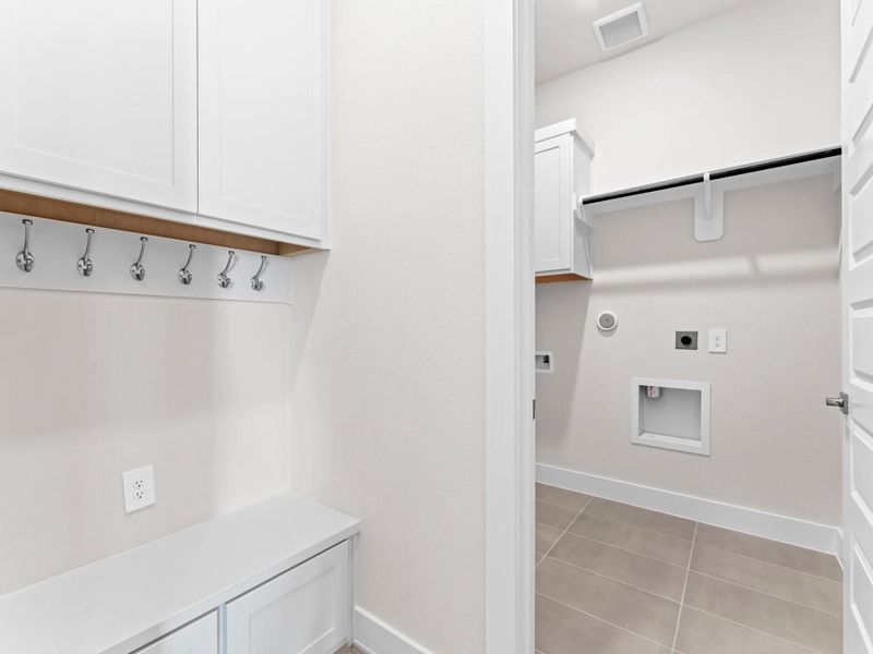 Built-in Bench with Hooks and Storage Cabinets to Keep You Organized Built-in Bench with Hooks and Storage Cabinets to Keep You Organized