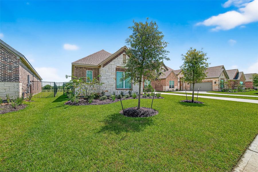 Front exterior of a new home in Sierra Vista, Iowa Colony, TX, highlighting curb appeal (Image 20). Front exterior of a new home in Sierra Vista, Iowa Colony, TX, highlighting curb appeal (Image 20).