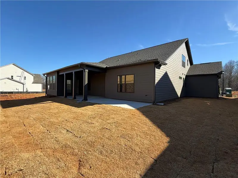Exterior details and patio area of a home in Ponderosa Farms Manor, Gainesville (Image 3).