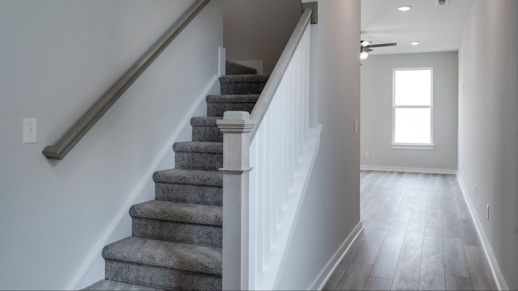 Stairway off the front entrance next to hallway