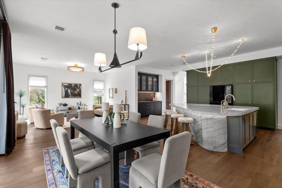 The bright & airy dining room includes an Auxerre chandelier.