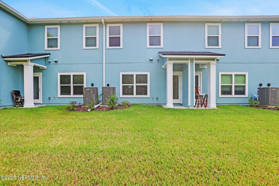 Front exterior of a new home in Atlantis Pointe, Middleburg, FL, highlighting curb appeal (Image 17).