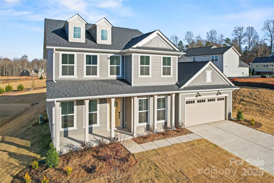 Front exterior of a new home in Forest Creek, Waxhaw, NC, highlighting curb appeal (Image 20).