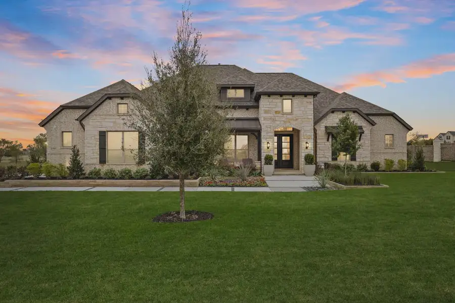 Front exterior of a new home in Lakeway Estates, Waxahachie, TX, highlighting curb appeal (Image 2).