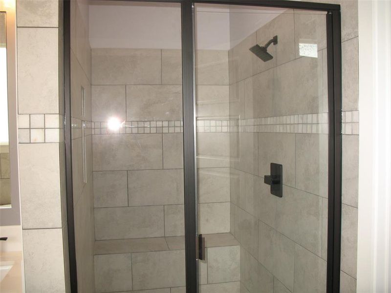 Bathroom featuring a shower stall