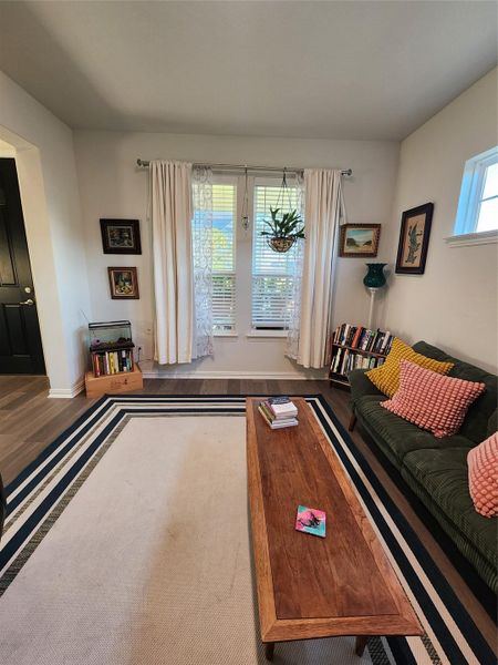 Laminated flooring adds a contemporary touch to this inviting living room.