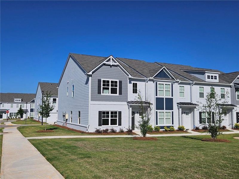 Front exterior of a new home in , Conyers, GA, highlighting curb appeal (Image 22).