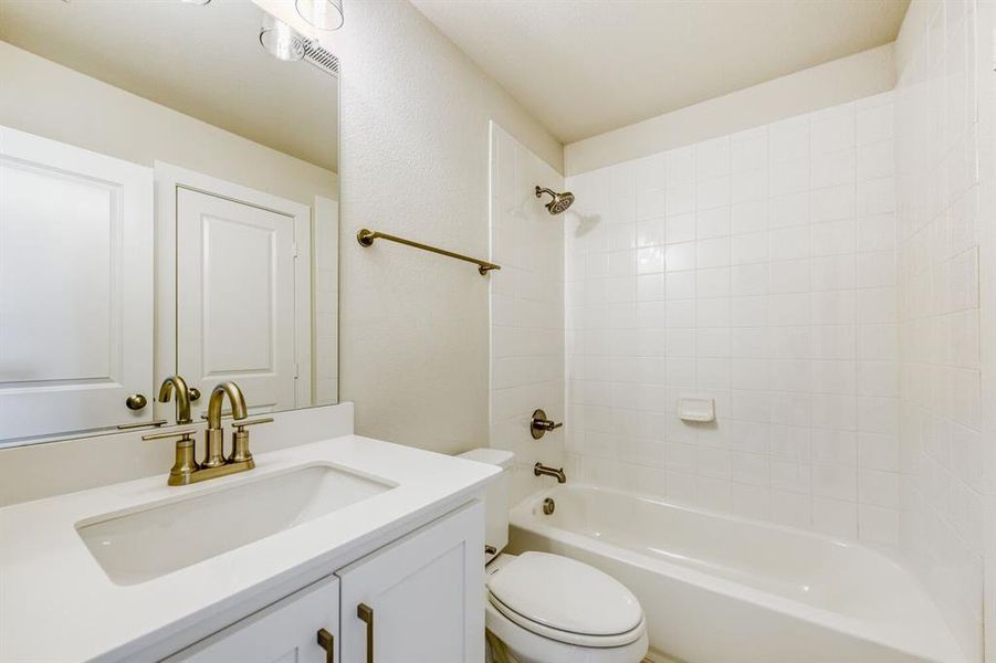 Bathroom featuring vanity and bathing tub / shower combination