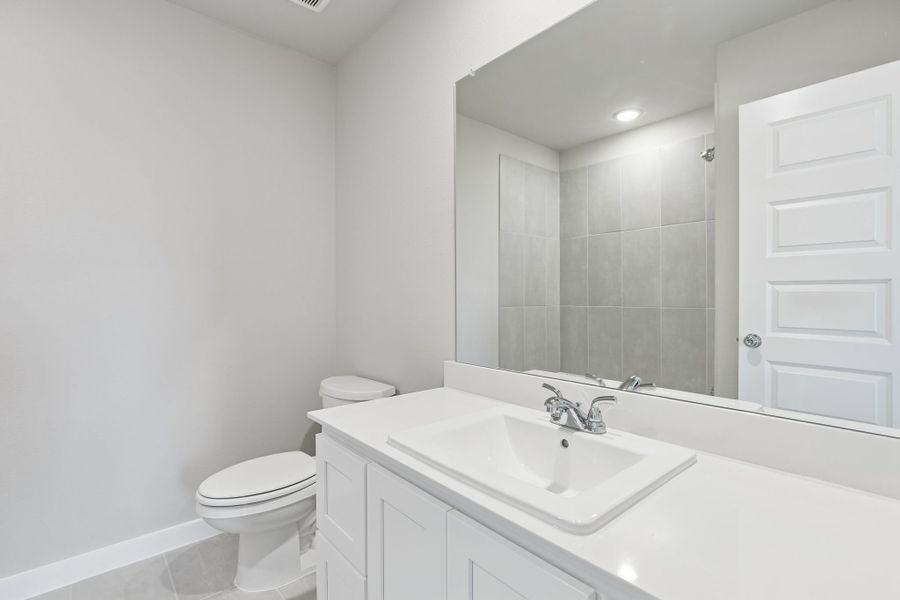 Bathroom in the Holden home plan by Trophy Signature Homes – REPRESENTATIVE PHOTO Bathroom in the Holden home plan by Trophy Signature Homes – REPRESENTATIVE PHOTO