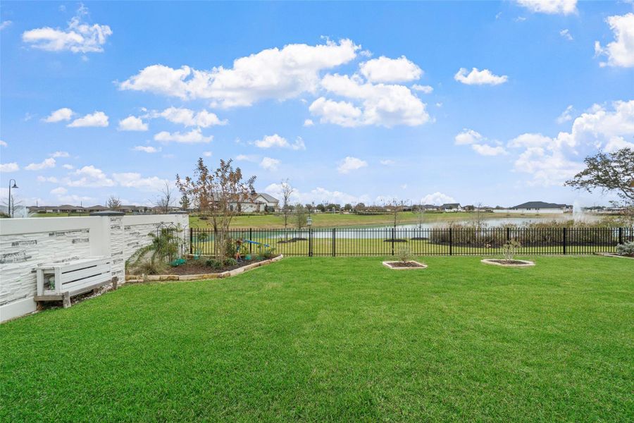 The back yard offers views of the pond and opportunity to garden.
