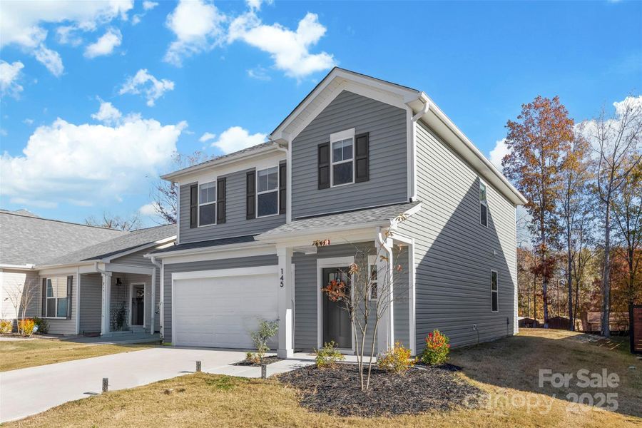 Front exterior of a new home in Surrey Woods, Charlotte, NC, highlighting curb appeal (Image 26).