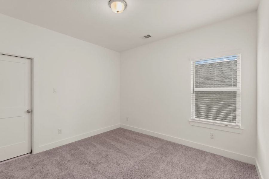 Representative unfurnished interior of a home built from the St Andrews by Chesmar Homes in Riceland Alley Loads, Mont Belvieu (Image 64).