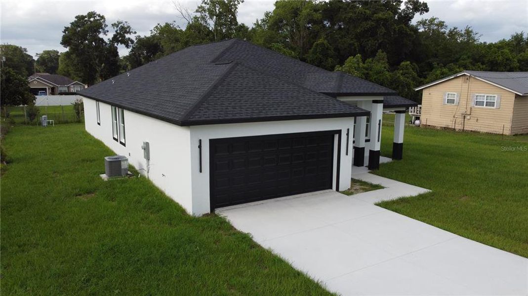 Front exterior of a new home in , Summerfield, FL, highlighting curb appeal (Image 25).