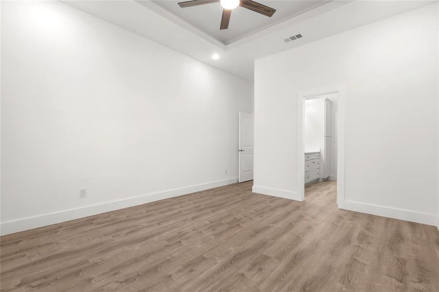 Spare room with ceiling fan and light hardwood / wood-style flooring