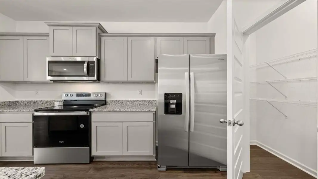 Furnished interior view inside a new home in Champion's Run, Lithonia (Image 6).