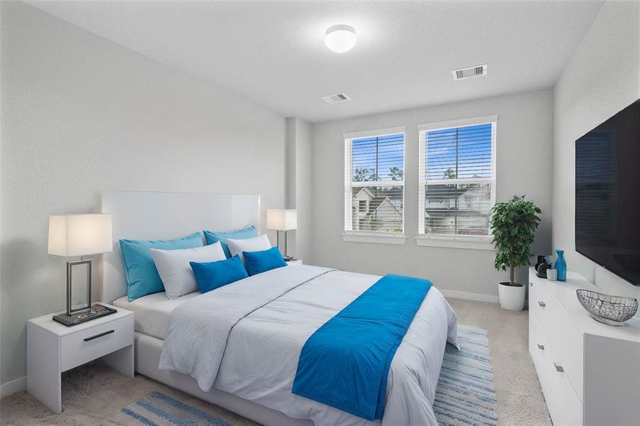 Secondary bedroom features plush carpet, custom paint, high ceilings, and large windows with privacy blinds.