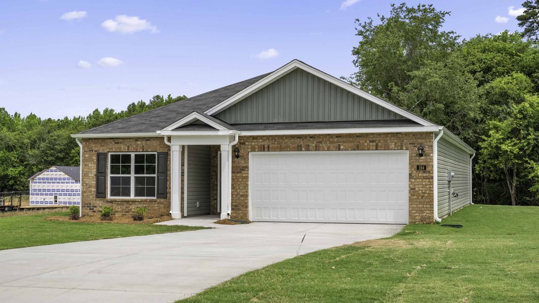 Front exterior of a new home in Waverly Place, Linwood, NC, highlighting curb appeal (Image 2). Front exterior of a new home in Waverly Place, Linwood, NC, highlighting curb appeal (Image 2).