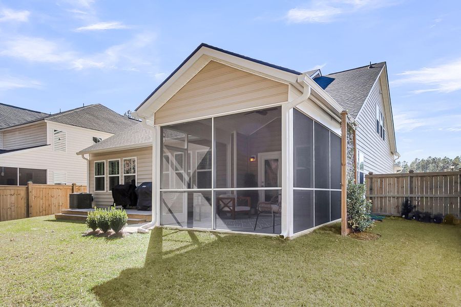 Exterior details and patio area of a home in Sweetgrass at Summers Corner: Arbor Collection, Summerville (Image 26).