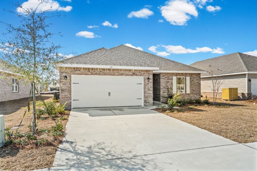 Front exterior of a new home in Natureview, Freeport, FL, highlighting curb appeal (Image 18).