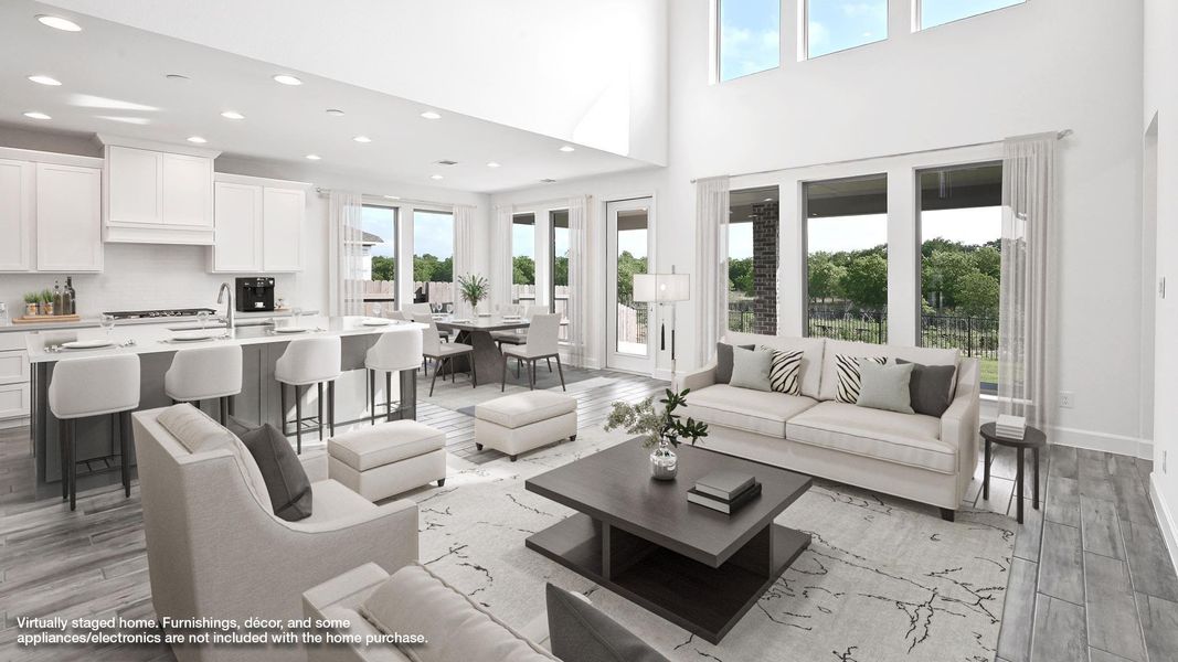 Living room featuring light wood-style flooring and recessed lighting Living room featuring light wood-style flooring and recessed lighting