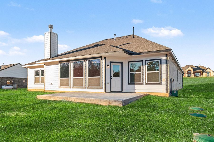 Exterior details and patio area of a home in Rose Hill Estates, Willis (Image 4).