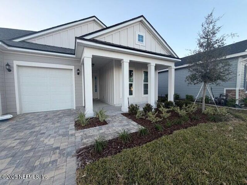 Front exterior of a new home in Silver Landing at SilverLeaf, St. Augustine, FL, highlighting curb appeal (Image 23).
