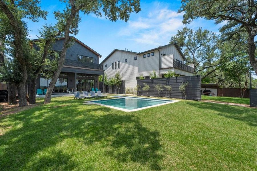 A resort-inspired pool with a spacious tanning ledge offers the perfect place to cool off while enjoying peaceful Hill Country and Canyon Lake views. A resort-inspired pool with a spacious tanning ledge offers the perfect place to cool off while enjoying peaceful Hill Country and Canyon Lake views.