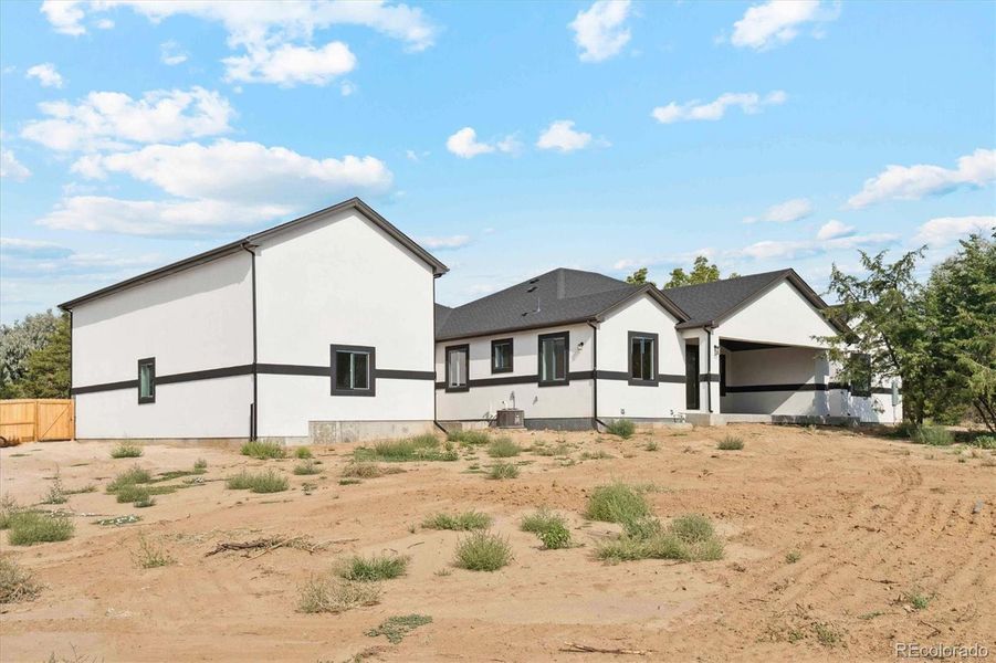 Front exterior of a new home in , Brighton, CO, highlighting curb appeal (Image 23).