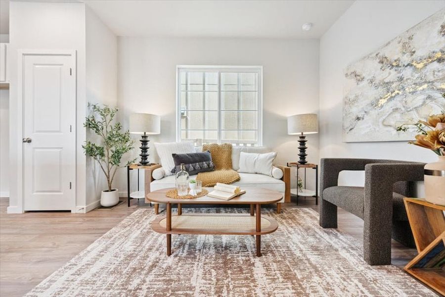 A living room with a couch and a coffee table. A living room with a couch and a coffee table.