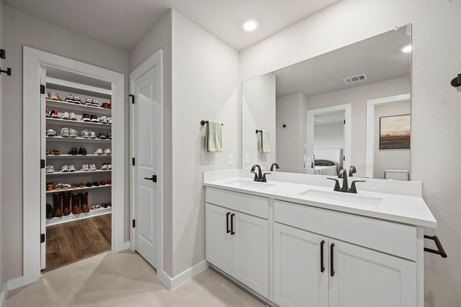 Clean lines and a spacious double vanity define this modern, light-filled bathroom. Clean lines and a spacious double vanity define this modern, light-filled bathroom.