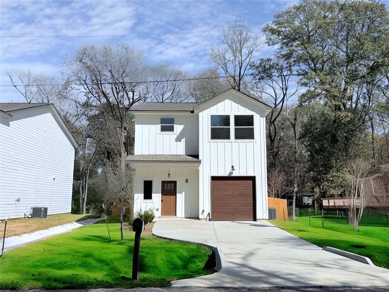 Front exterior of a new home in , Conroe, TX, highlighting curb appeal (Image 28).
