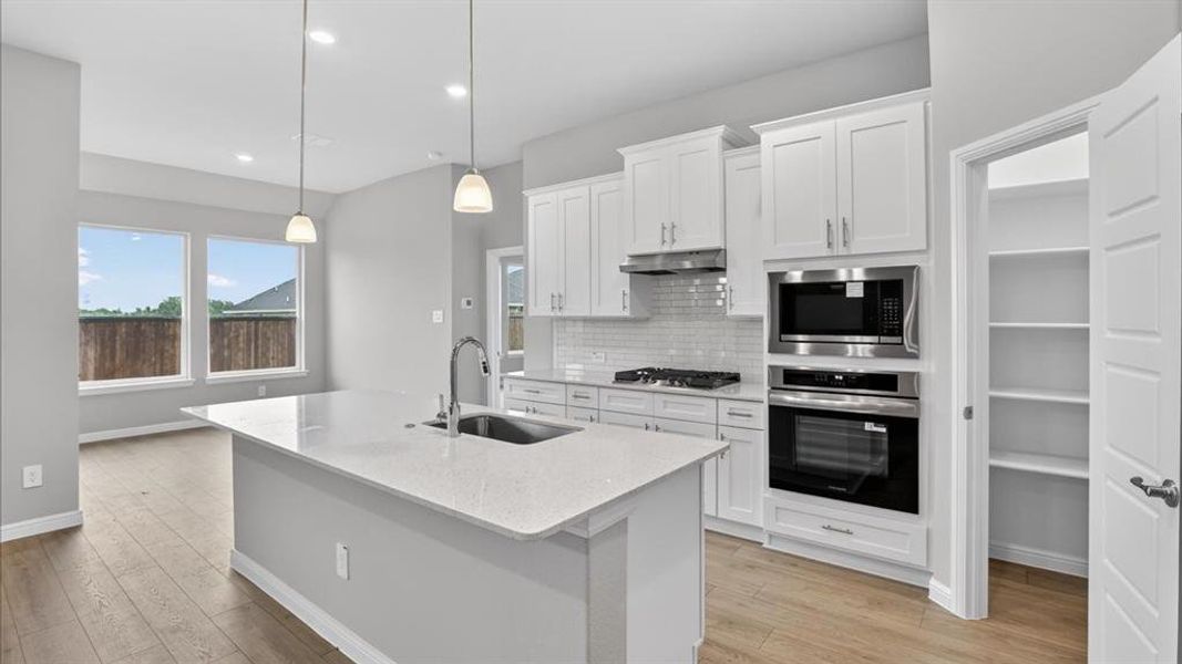 Kitchen - All Home and community information, including pricing, included features, terms, availability and amenities, are subject to change at any time without notice or obligation. All Drawings, pictures, photographs, video, square footages, floor plans, elevations, features, colors and sizes are approximate for illustration purposes only and will vary from the homes as built.