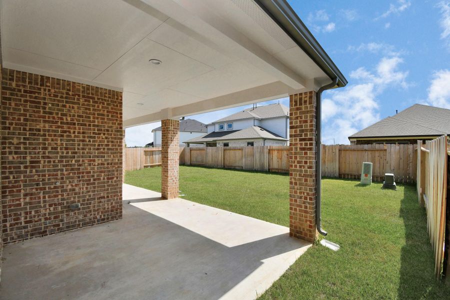 Experience outdoor living at its finest on this expansive covered patio, thoughtfully designed for BBQs and delightful outdoor dining. Experience outdoor living at its finest on this expansive covered patio, thoughtfully designed for BBQs and delightful outdoor dining.