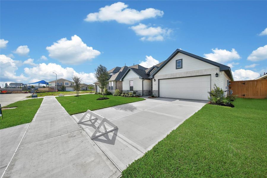 Front exterior of a new home in , Rosharon, TX, highlighting curb appeal (Image 2). Front exterior of a new home in , Rosharon, TX, highlighting curb appeal (Image 2).