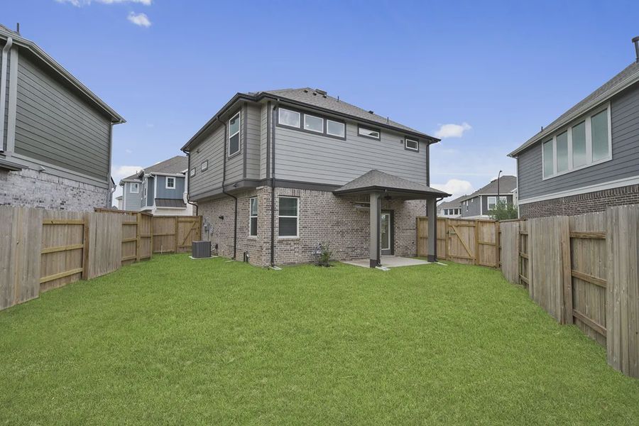 Exterior details and patio area of a home in Elyson Courtyard Collection, Katy (Image 17).
