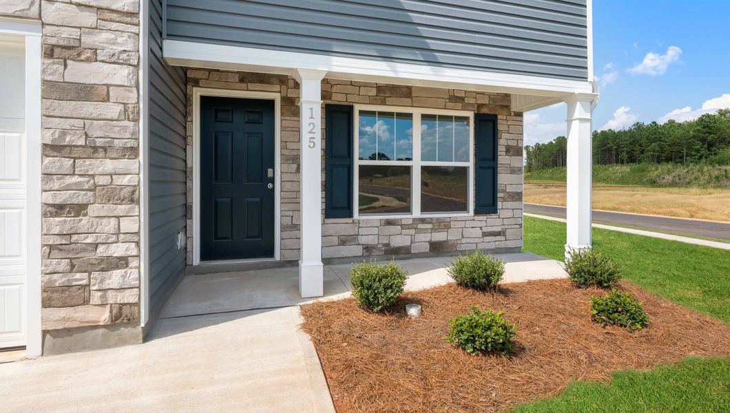 Front exterior of a new home in Cedar Gap, Fountain Inn, SC, highlighting curb appeal (Image 2). Front exterior of a new home in Cedar Gap, Fountain Inn, SC, highlighting curb appeal (Image 2).
