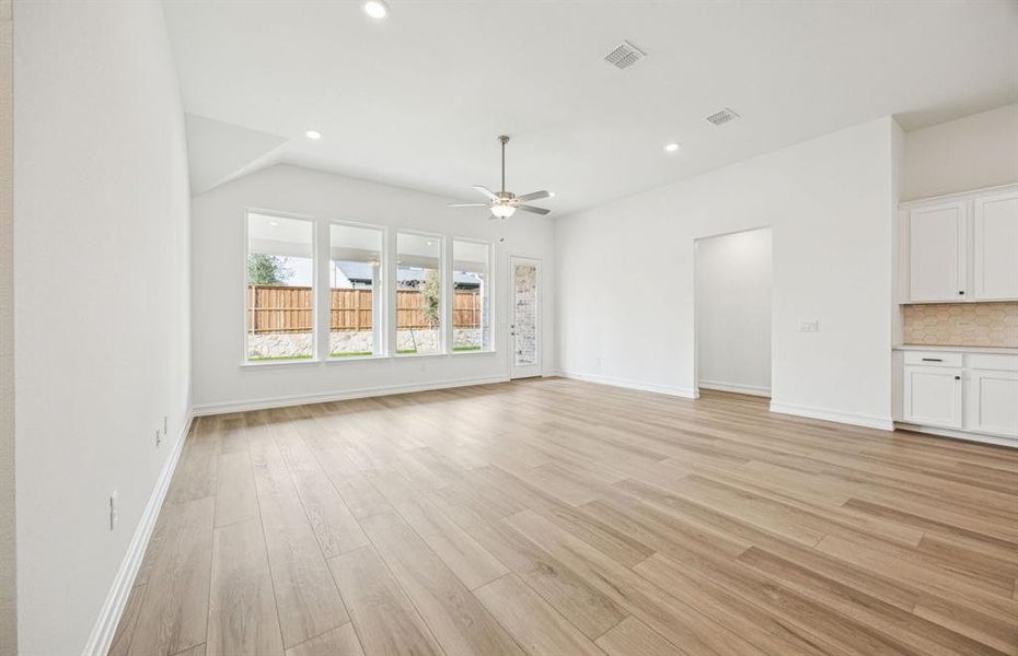 Sunlit gathering room designed for relaxation and entertainment Sunlit gathering room designed for relaxation and entertainment