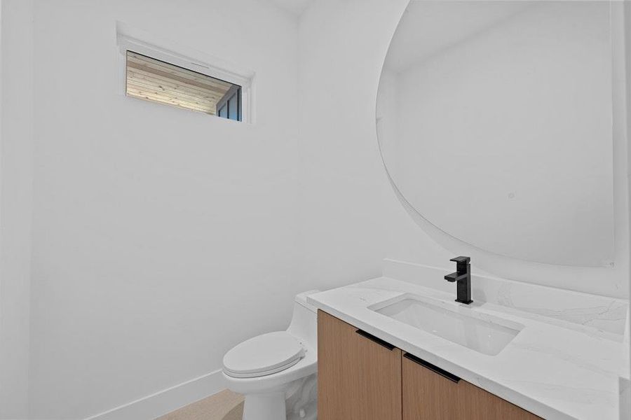 Bathroom with vanity and toilet